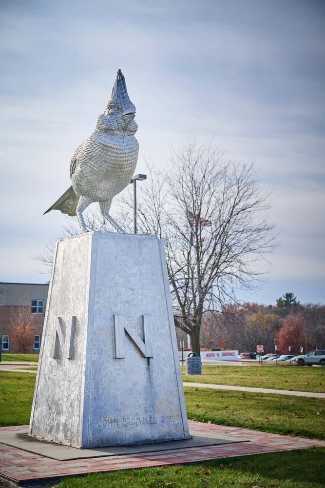 Exterior of Newton High School, a tan brick building.
