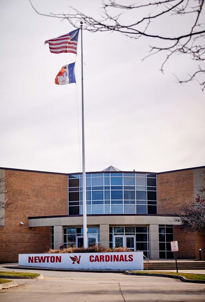 Exterior of Newton High School, a tan brick building.