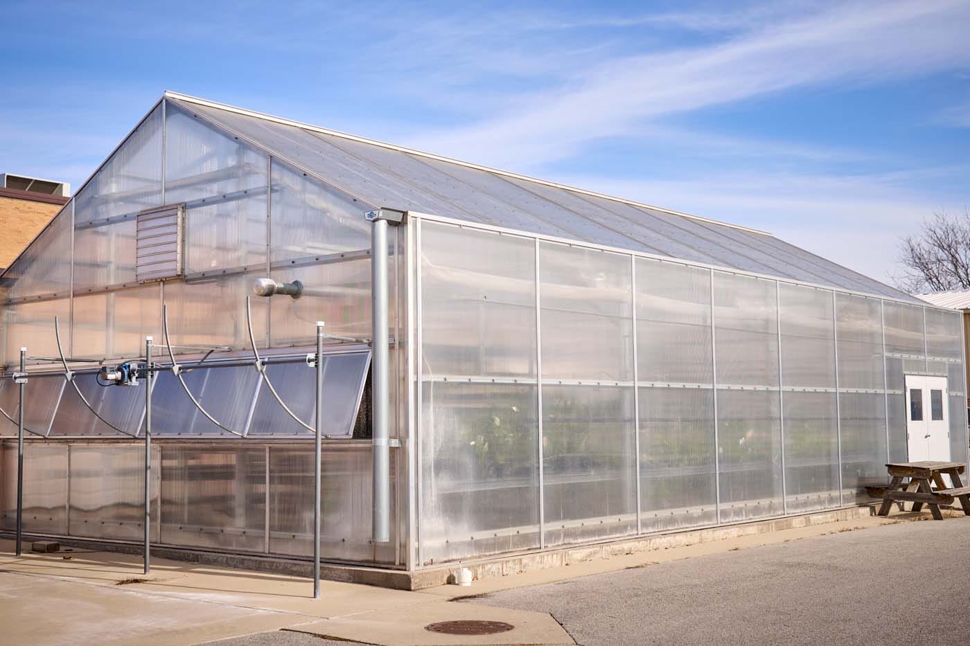 Exterior of Newton High School, a tan brick building.