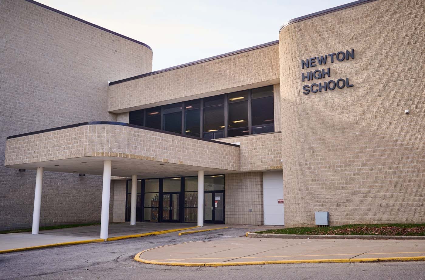 Exterior of Newton High School, a tan brick building.