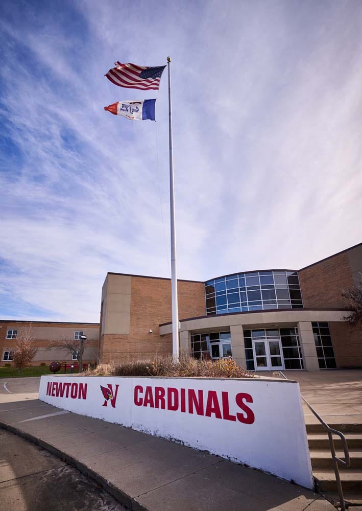 Exterior of Newton High School, a tan brick building.