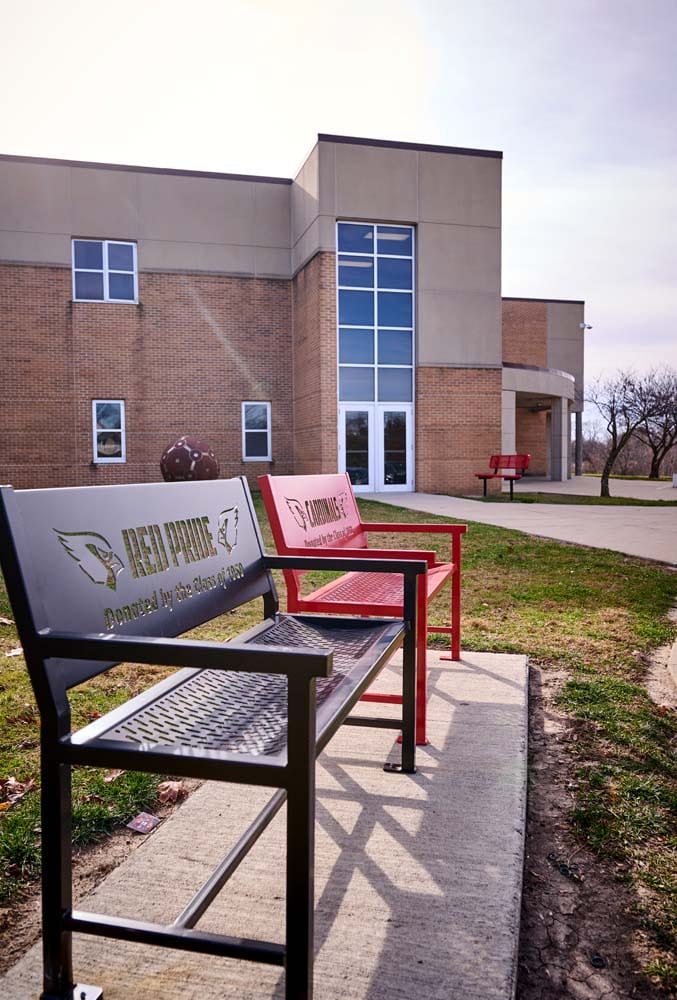 Exterior of Newton High School, a tan brick building.